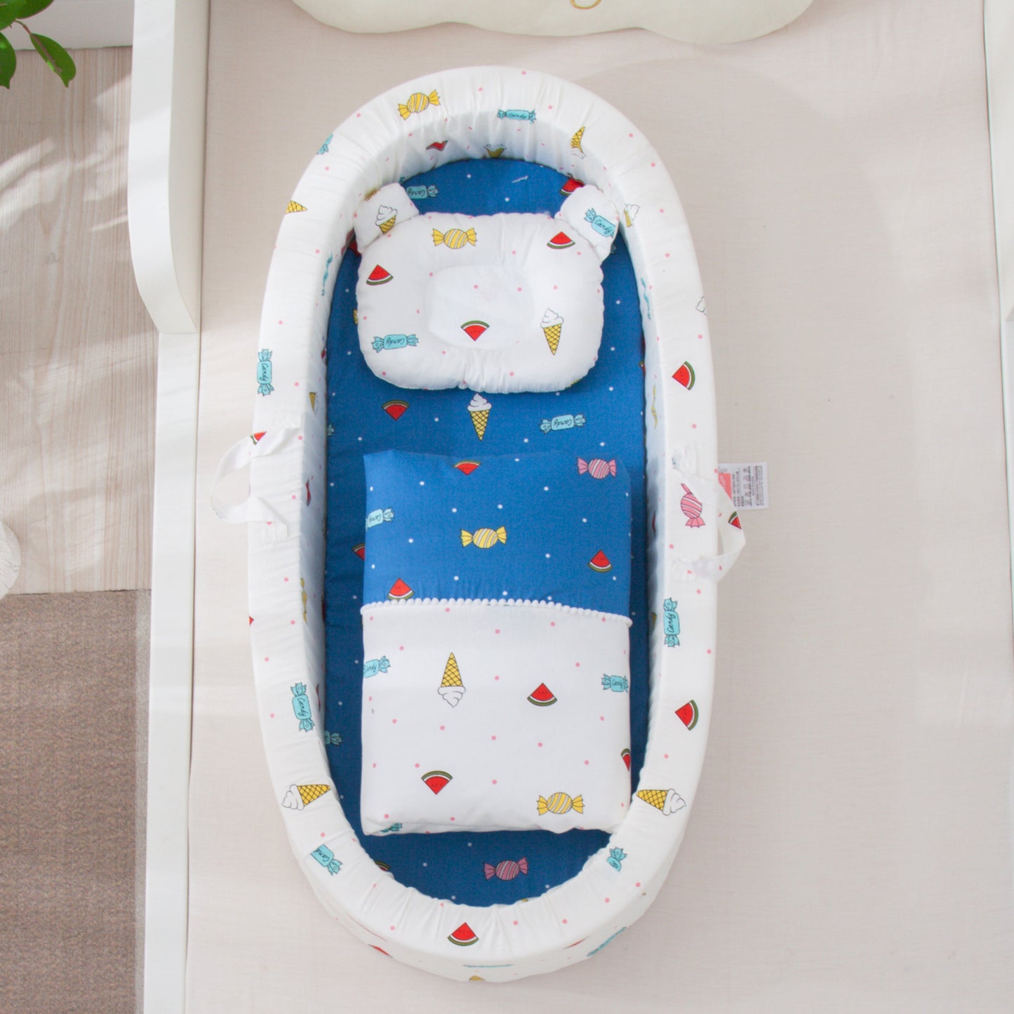 Baby crib with colorful patterns on a neutral background