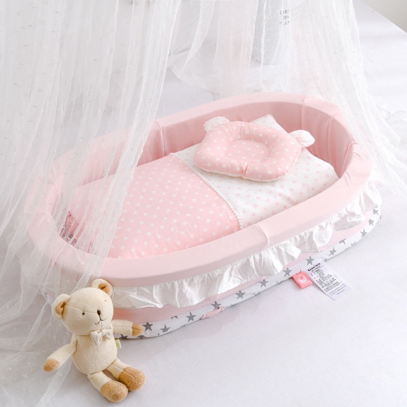 Pink baby crib with