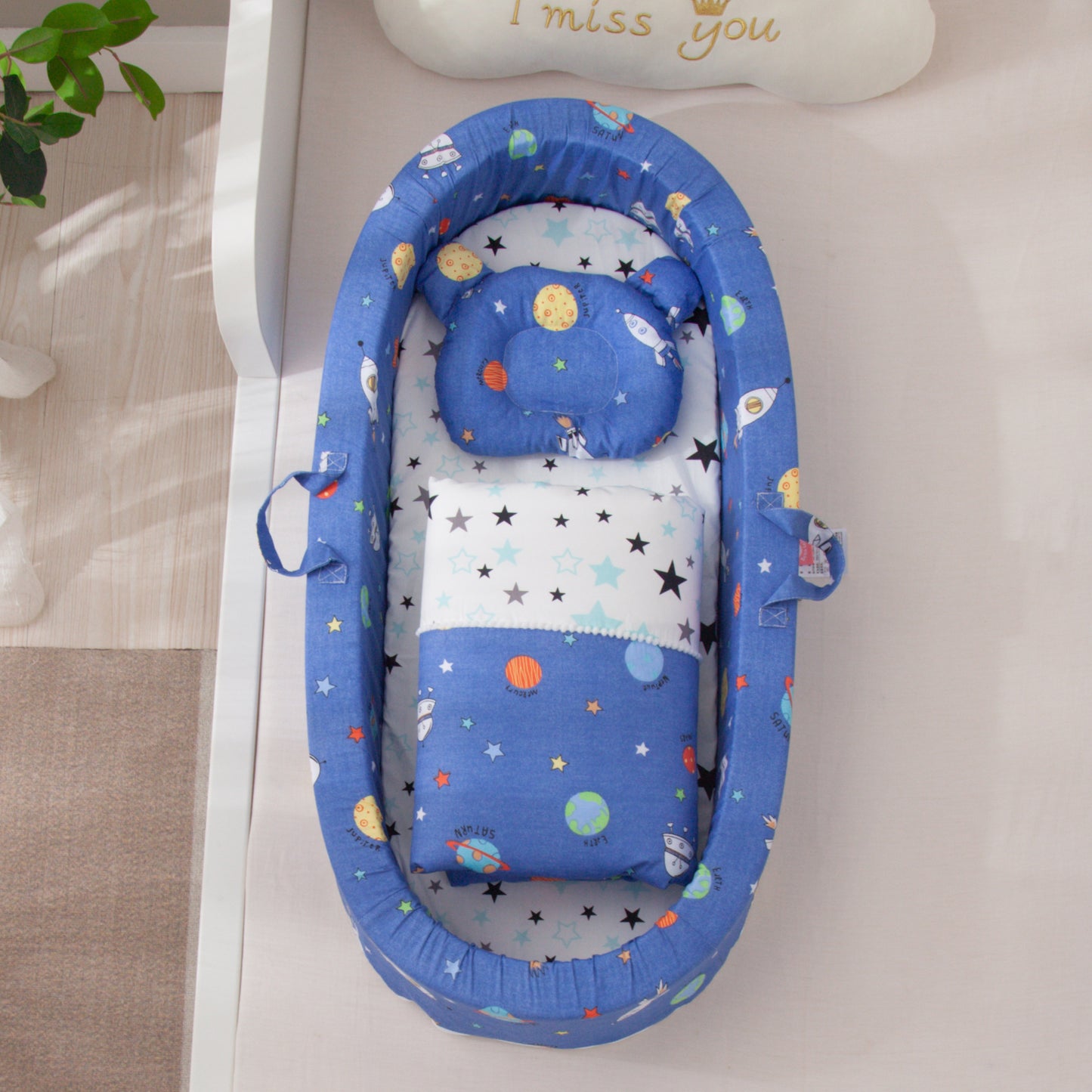 Blue baby crib with space-themed design