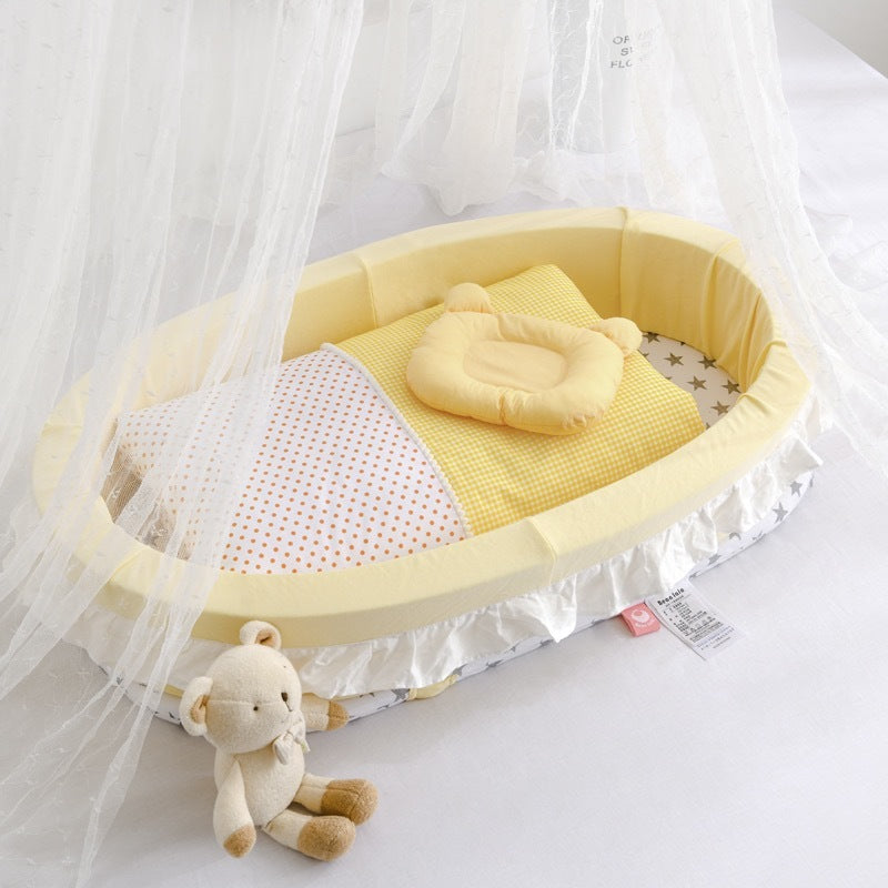 Yellow baby crib with bedding
